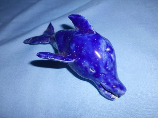 A clay dolphin